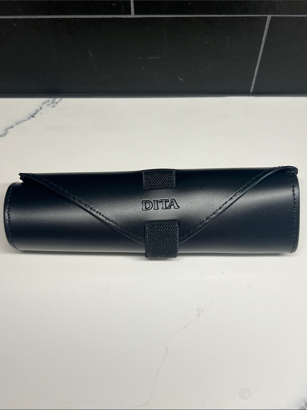 Dita black leather roll-up case for sunglasses